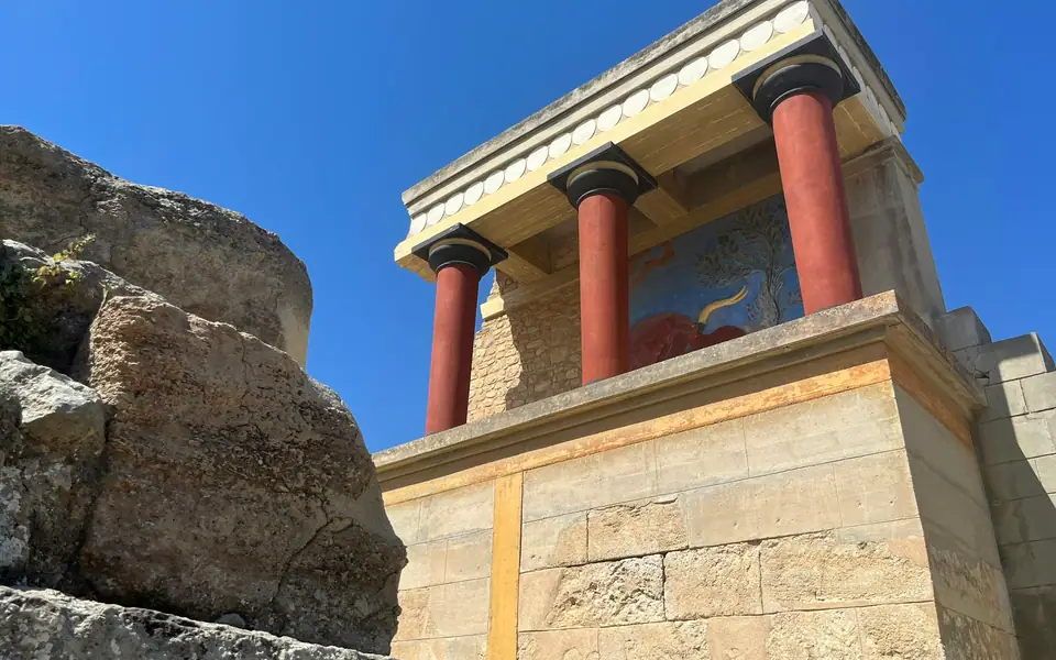Red columns and reconstructed fresco at the Palace of Knossos, Crete